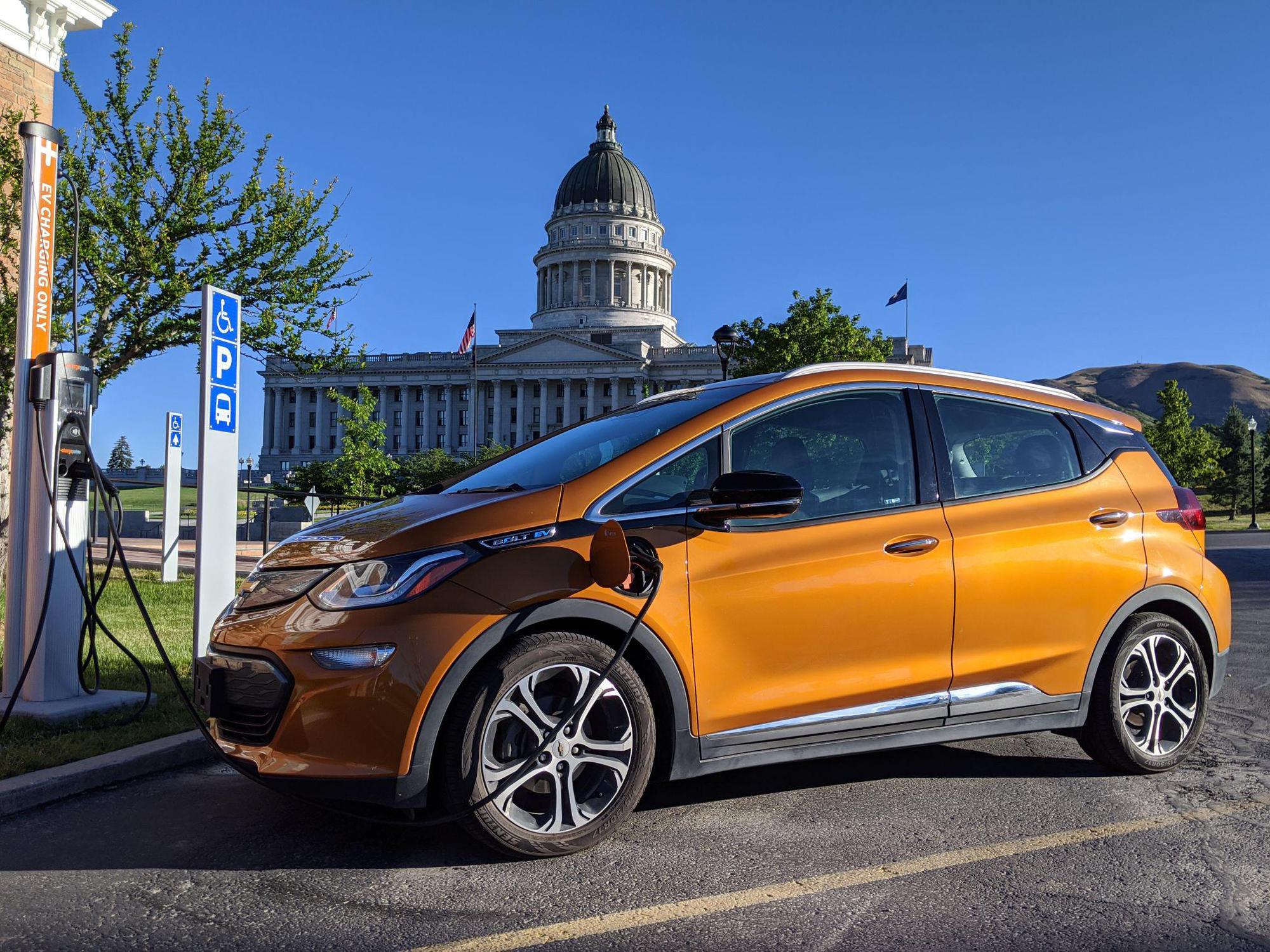 Vehicle at electric charging station by Utah state capitol